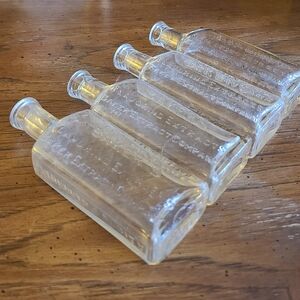 Set of Four Clear Glass Bottles